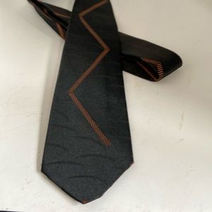 Schiaparelli 52” long Narrow 2.5 at widest part at bottom A vintage tie!
